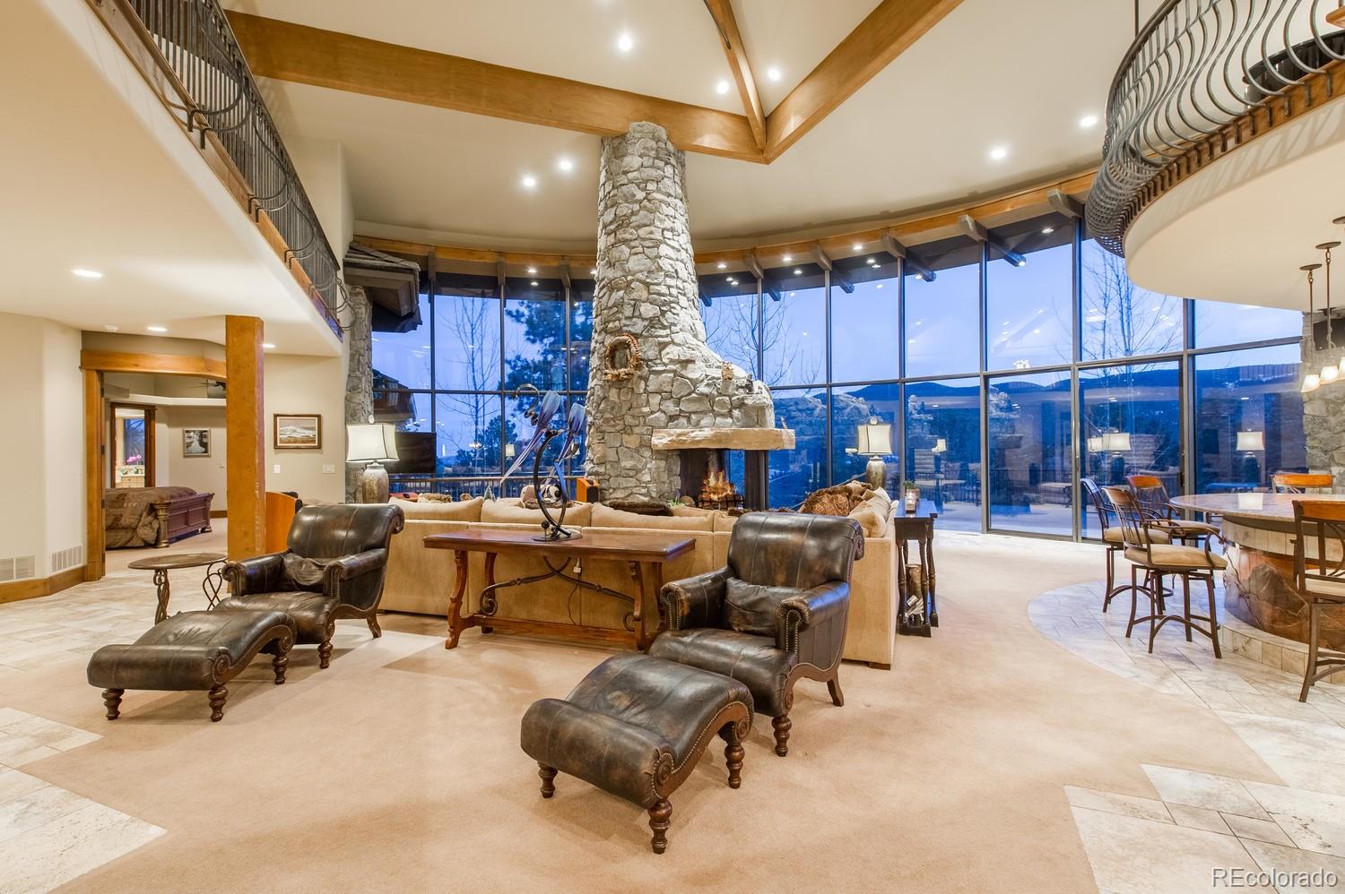 34700 Fox Ridge Road Evergreen, CO 80439 - Photo 8 of 35 a living room with furniture and a large window