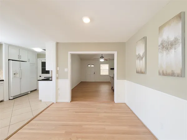 a view of a kitchen cabinets and wooden floor