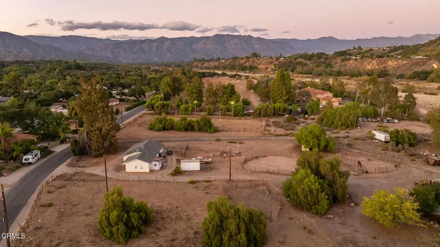 an aerial view of a house with outdoor space
