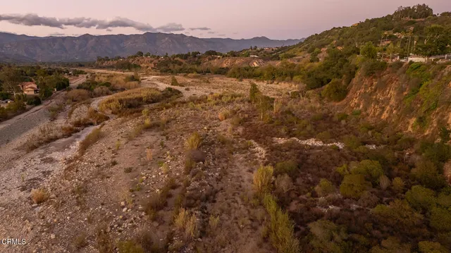 an aerial view of residential house and green space