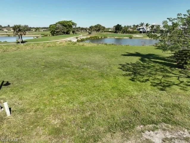 a view of a lake with a big yard