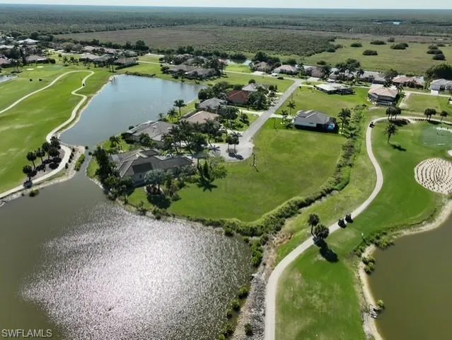 an aerial view of a golf course with swimming pool