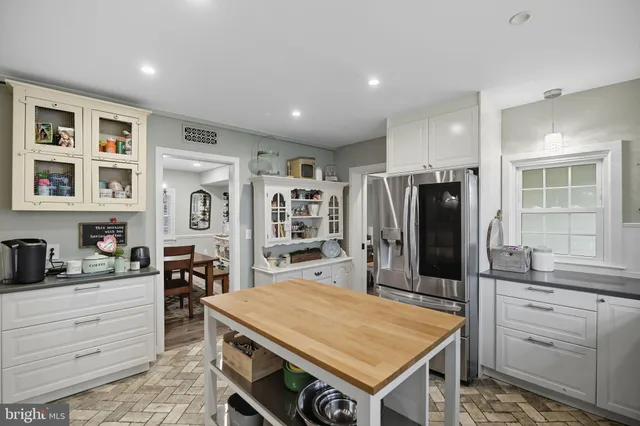 a bathroom with double sink and a mirror
