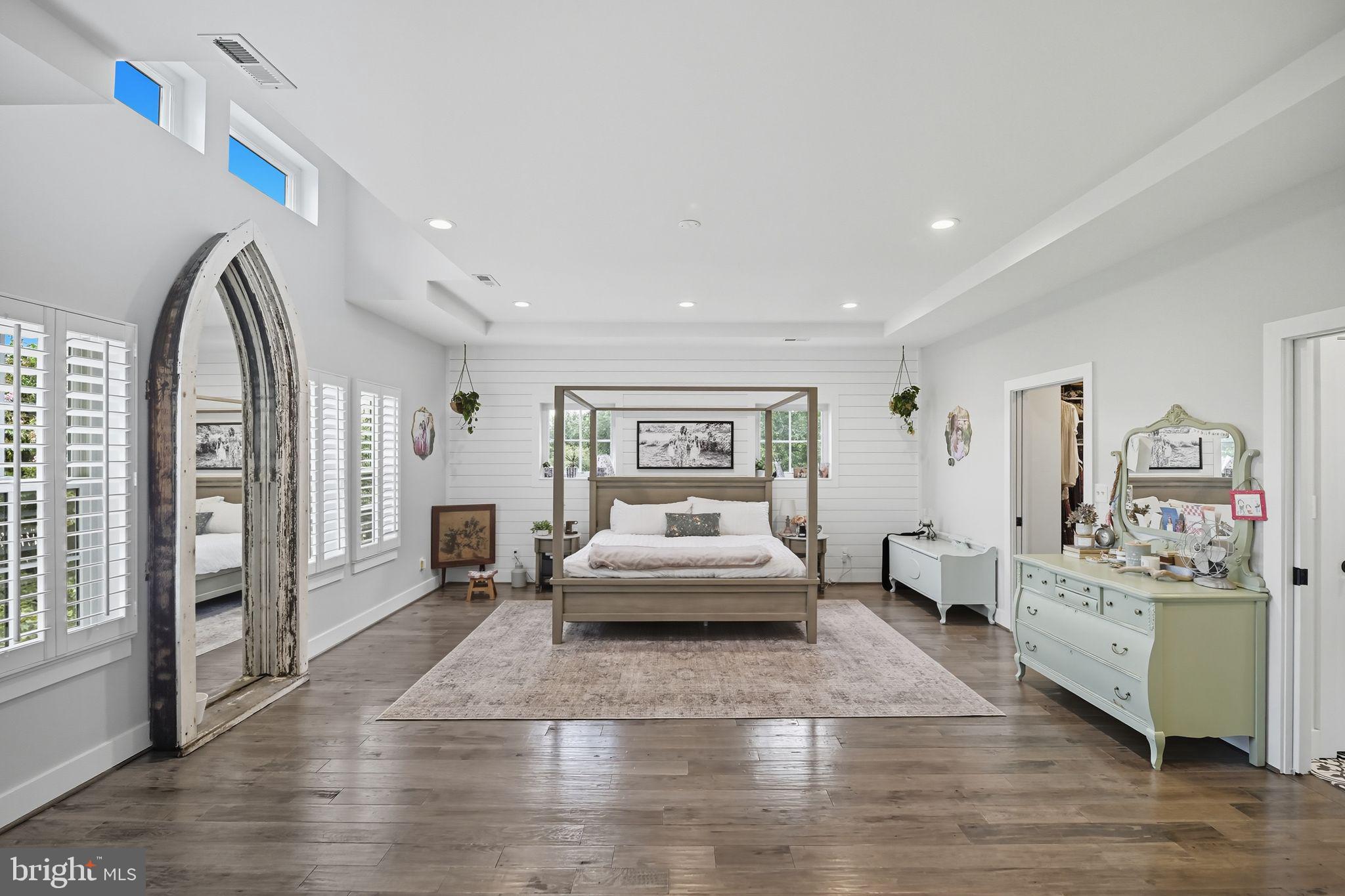 9105 Ewell Street Manassas, VA 20110 - Photo 48 of 81 Primary bedroom with high ceilings & shiplap wall