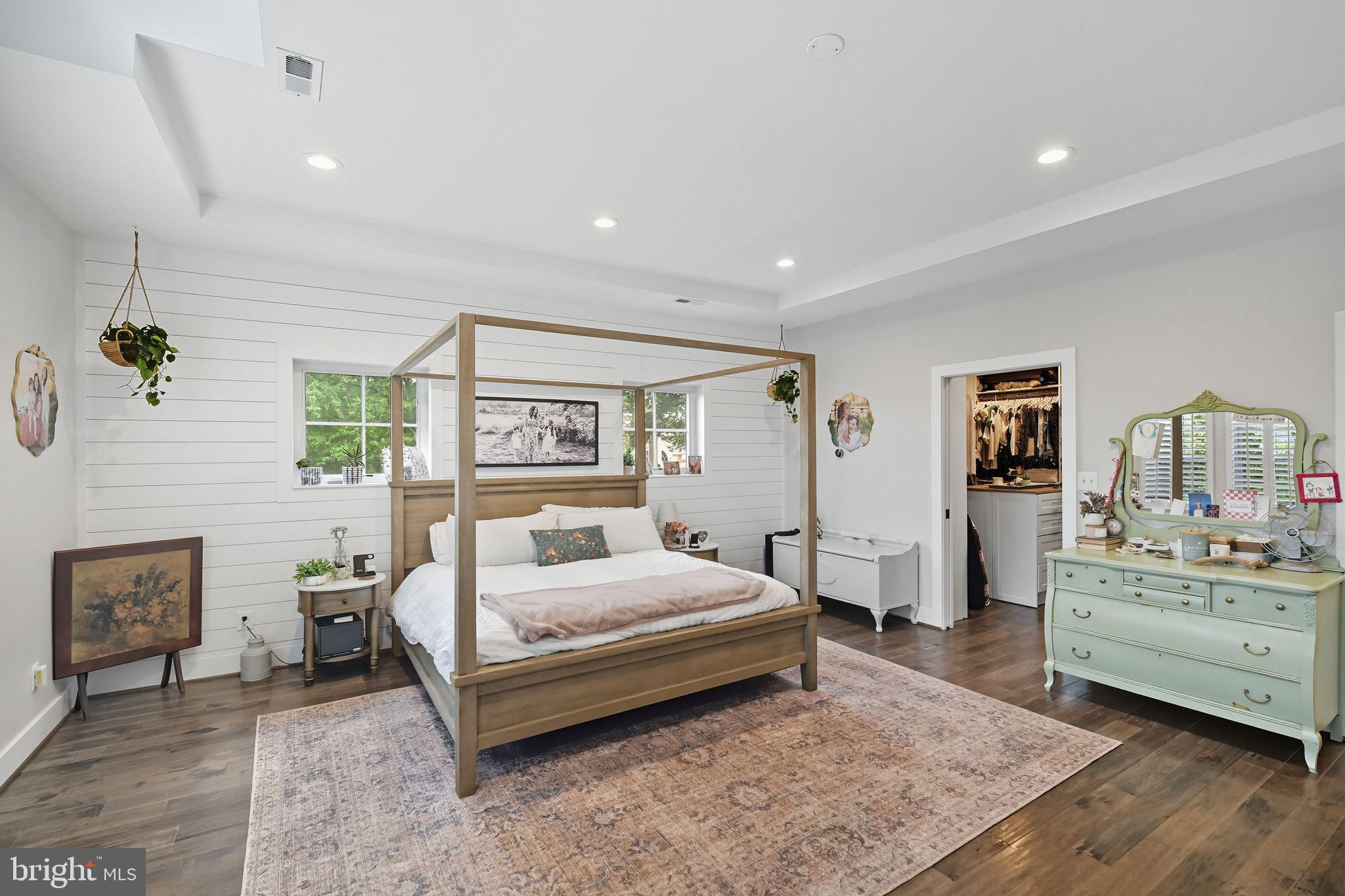 9105 Ewell Street Manassas, VA 20110 - Photo 49 of 81 Primary bedroom with high ceilings & shiplap wall