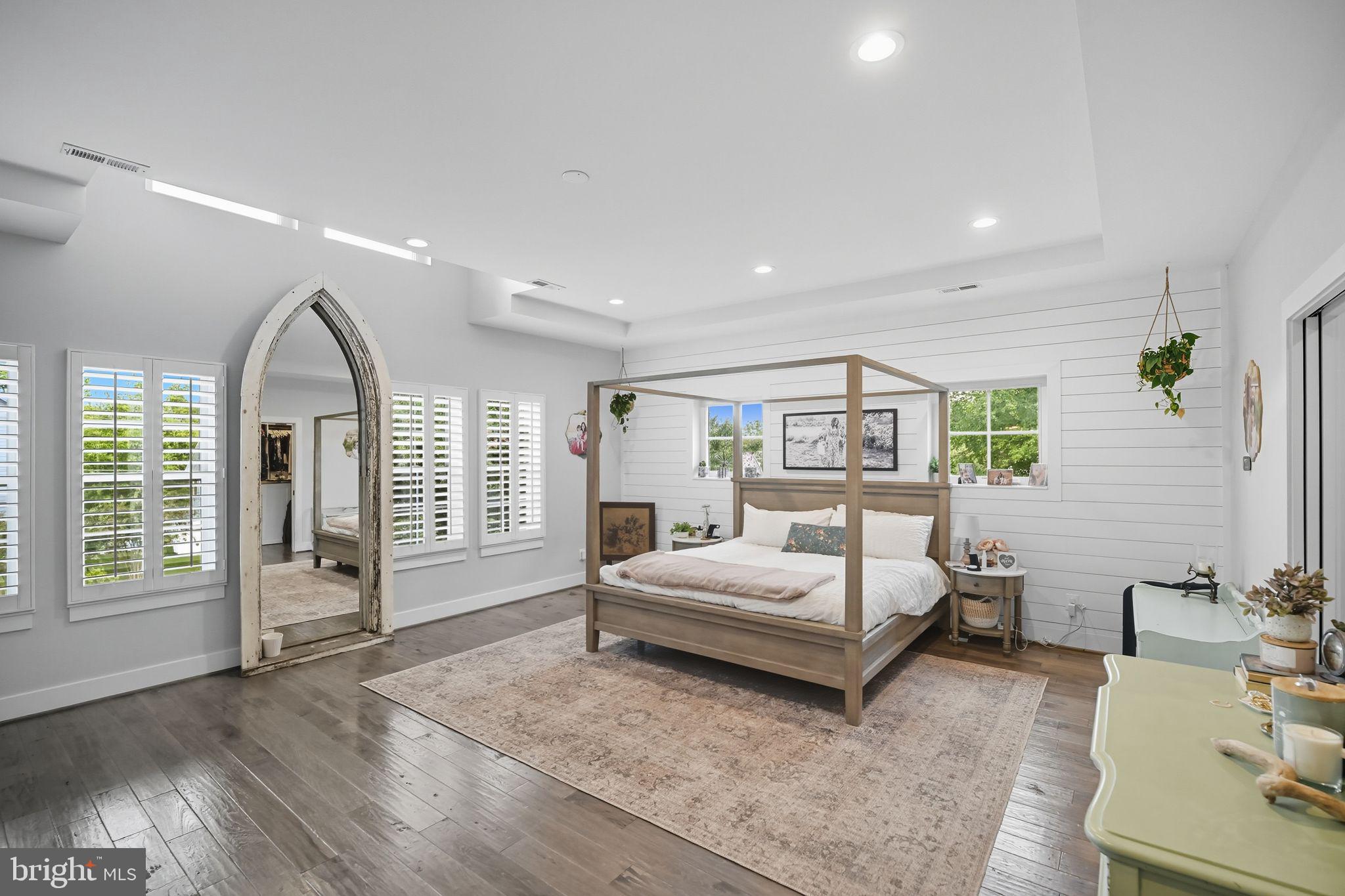 9105 Ewell Street Manassas, VA 20110 - Photo 51 of 81 Primary bedroom with high ceilings & shiplap wall