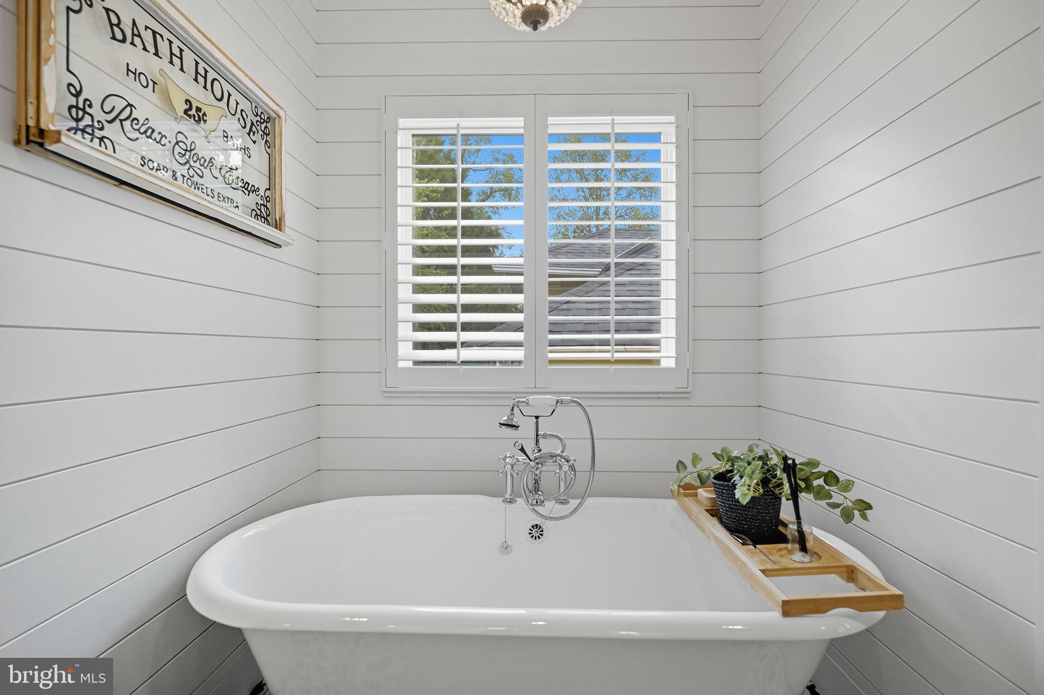9105 Ewell Street Manassas, VA 20110 - Photo 57 of 81 Primary bath with shiplap wall & clawfoot tub