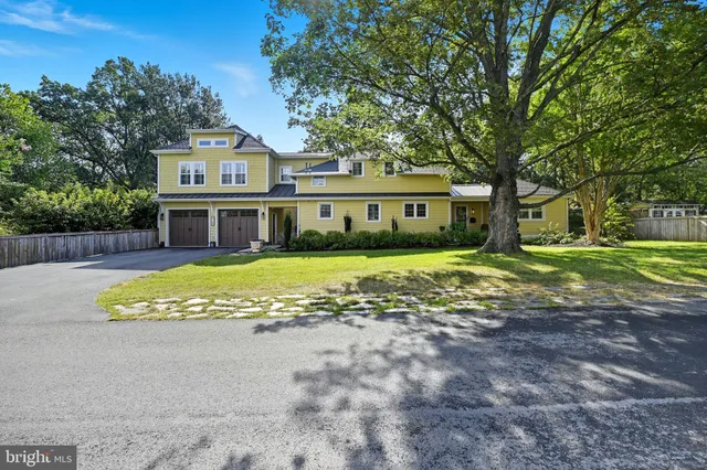a view of a swimming pool with a patio and fire pit