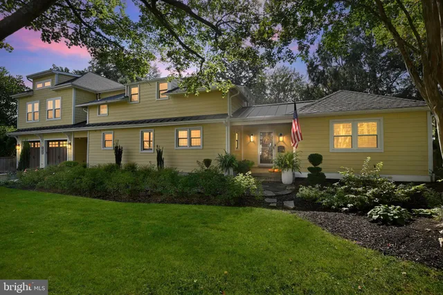 an aerial view of a house with a yard basket ball court and outdoor seating