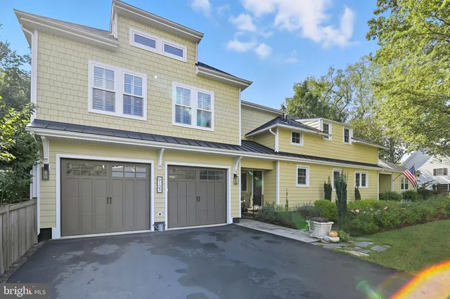an aerial view of a house with a yard and garden