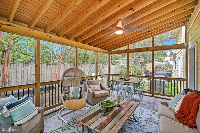 an aerial view of a house with a yard and swimming pool