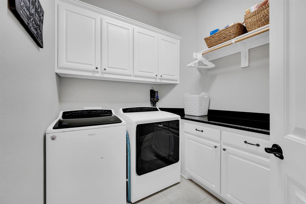 2650 Mc Alpin Road Midlothian, TX 76065 - Photo 19 of 36 Laundry area with cabinets and hanging area.