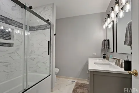 a bathroom with a sink and mirror