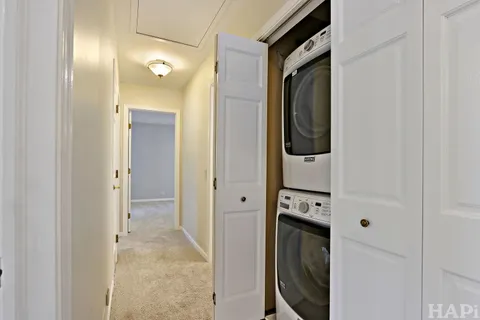a view of a hallway with washer and dryer