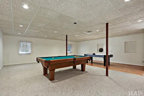 a sitting area with pool table