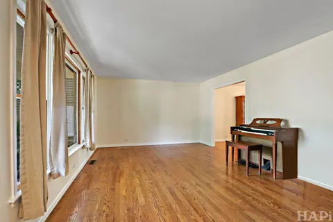 a view of a livingroom with furniture and wooden floor