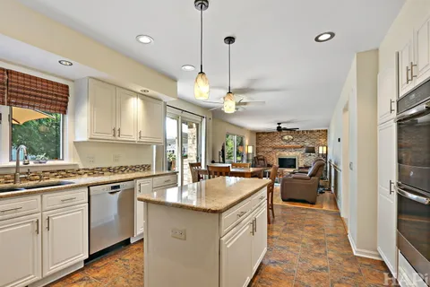 a kitchen with a sink stove and refrigerator