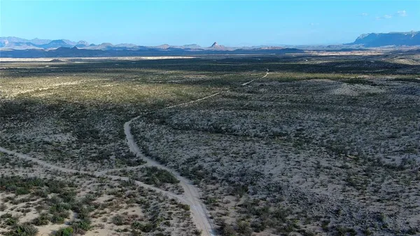a view of an ocean with a mountain