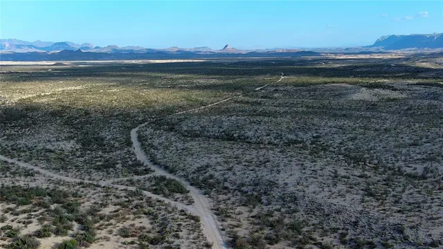 a view of an ocean with a mountain