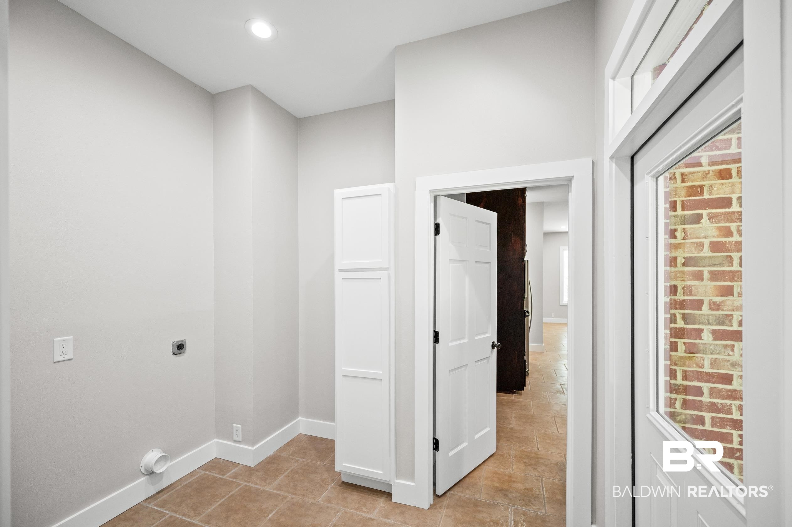 15031 Timber Ridge Drive Loxley, AL 36551 - Photo 31 of 43 Interior space featuring light tile patterned flooring and hookup for an electric dryer
