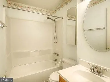 a bathroom with a shower curtain and a sink