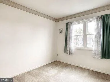 a view of an empty room and window