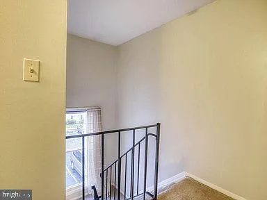 a view of a hallway with a white walls
