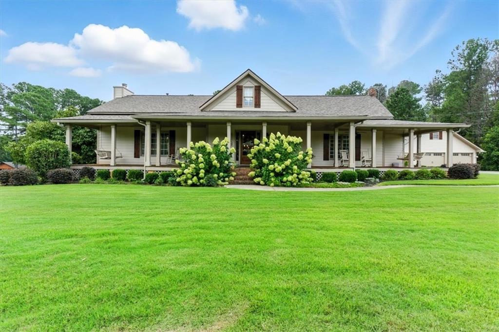 2304 Due West Road Dallas, GA 30157 - Photo 1 of 1 a front view of a house with a garden