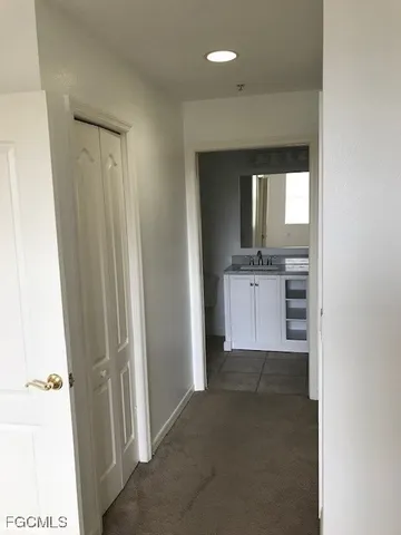 a bathroom with a sink and two mirror