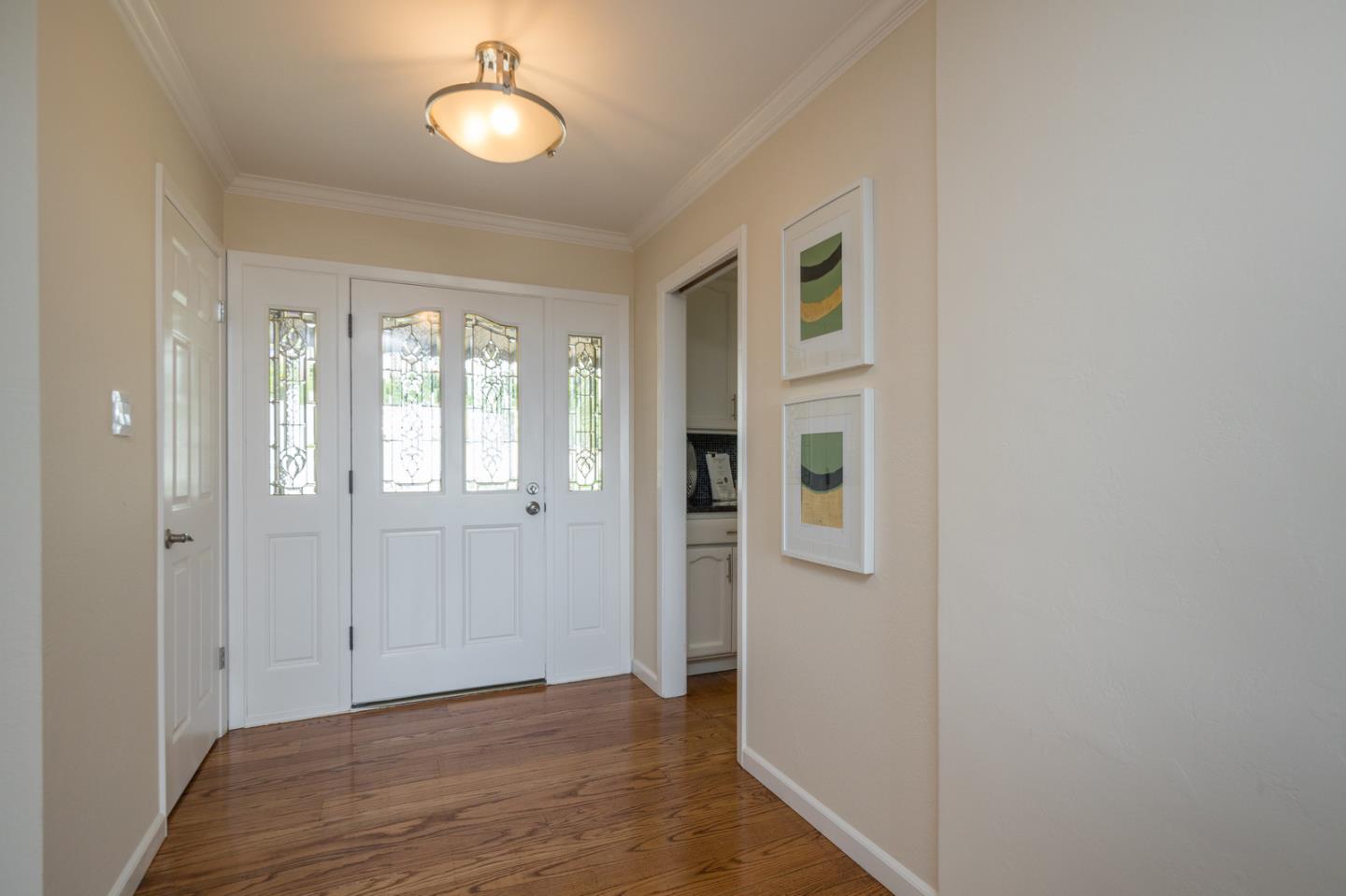 415 Middle Road Belmont, CA 94002 - Photo 11 of 32 a view of an empty room with wooden floor and a window