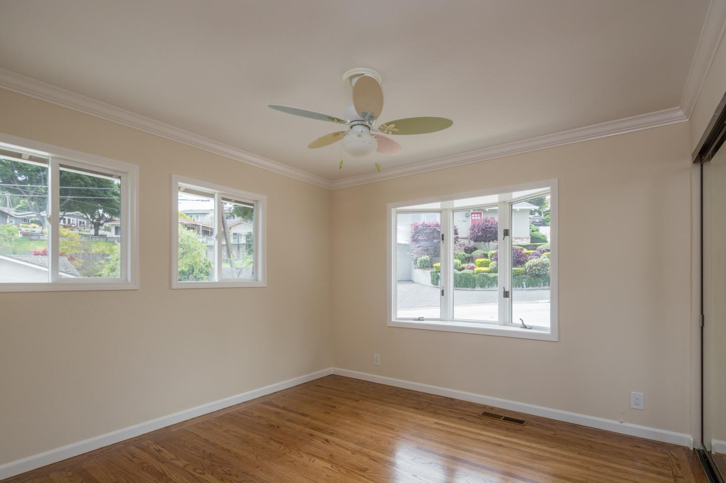 415 Middle Road Belmont, CA 94002 - Photo 13 of 32 a view of a room with wooden floor and a window