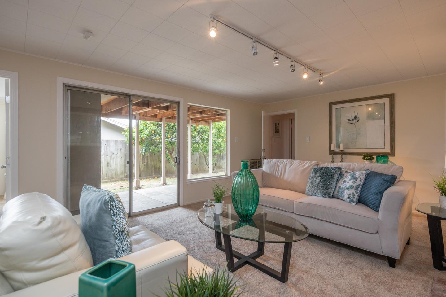 415 Middle Road Belmont, CA 94002 - Photo 19 of 32 a living room with furniture and a large window