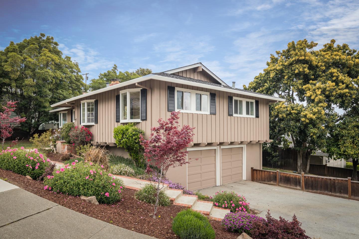 415 Middle Road Belmont, CA 94002 - Photo 2 of 32 a front view of a house with a yard
