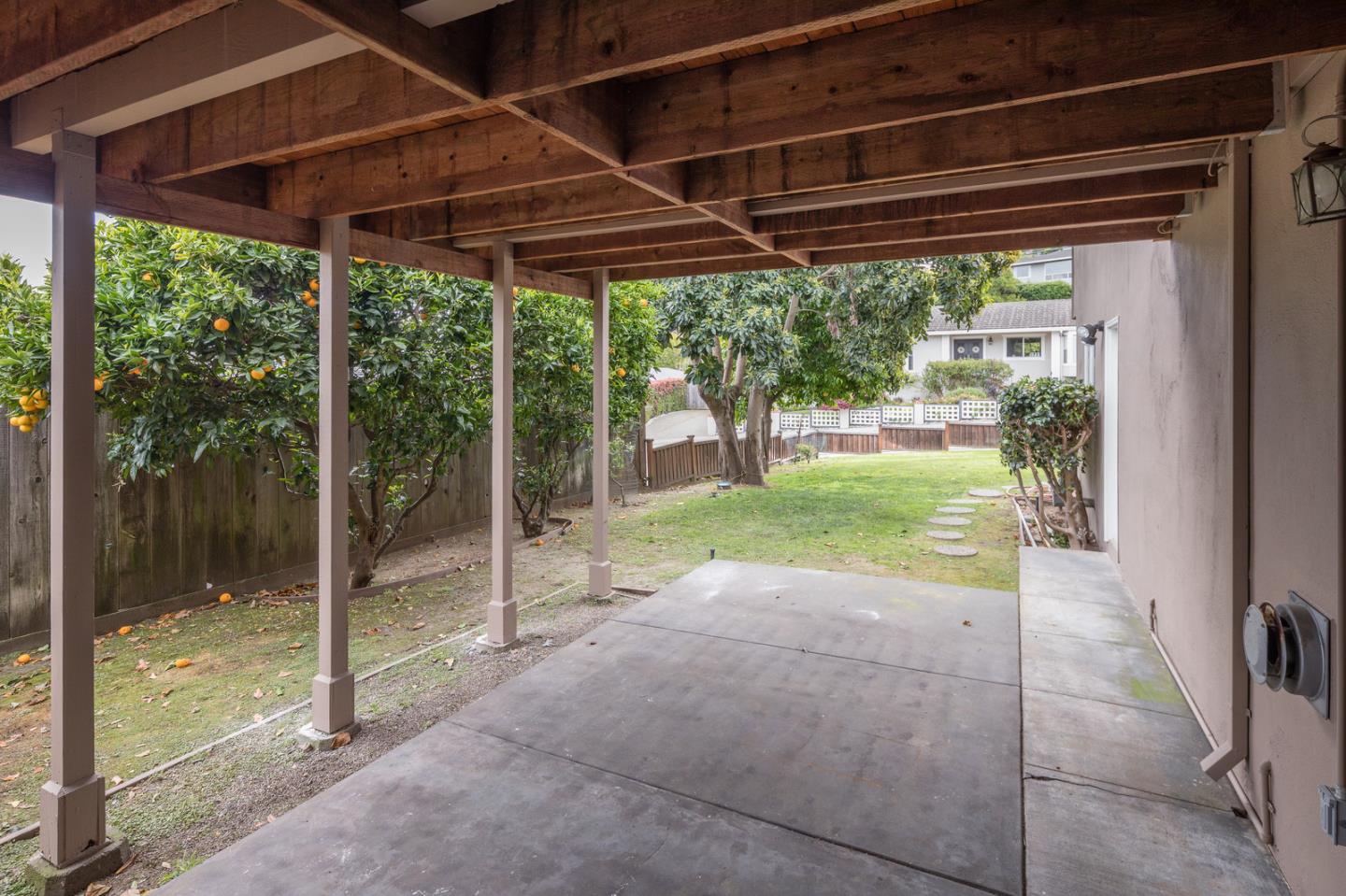 415 Middle Road Belmont, CA 94002 - Photo 25 of 32 a view of a backyard with floor to ceiling windows and floor to ceiling window