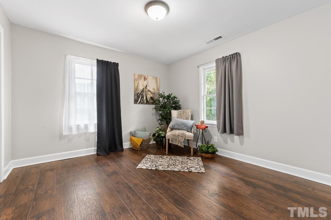 5314 Fayetteville Road Durham, NC 27713 - Photo 12 of 24 a living room with furniture and a wooden floor