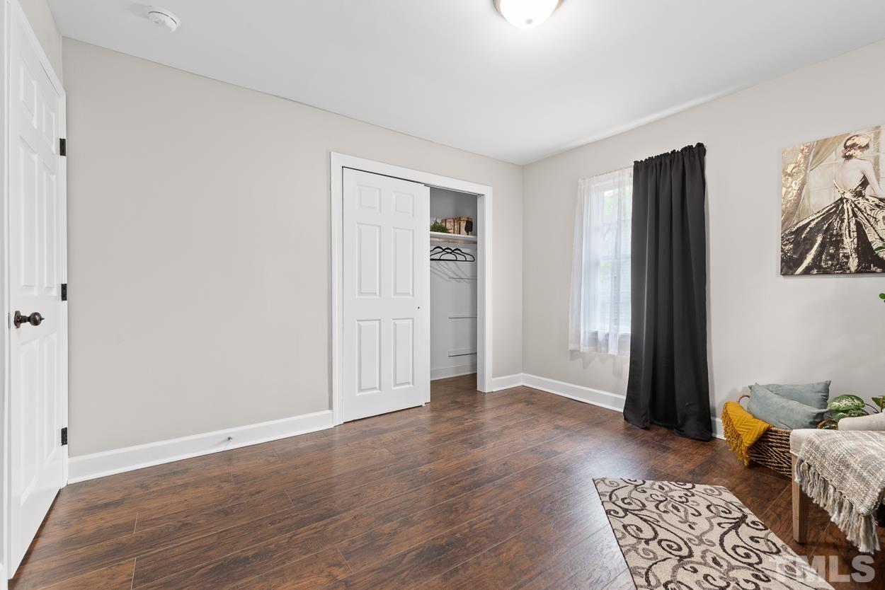 5314 Fayetteville Road Durham, NC 27713 - Photo 13 of 24 a view of room with furniture and wooden floor