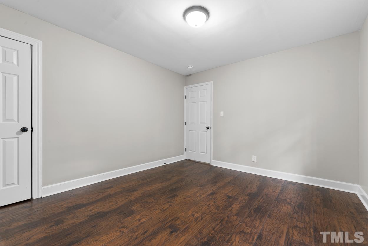 5314 Fayetteville Road Durham, NC 27713 - Photo 16 of 24 a view of room with wooden floor