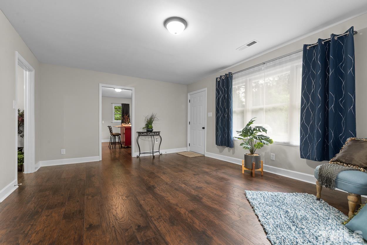 5314 Fayetteville Road Durham, NC 27713 - Photo 4 of 24 a living room with furniture and wooden floor