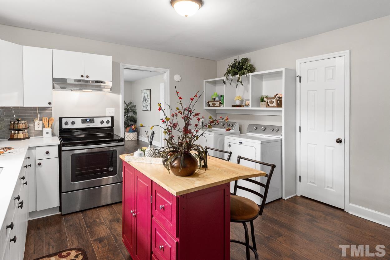 5314 Fayetteville Road Durham, NC 27713 - Photo 8 of 24 a kitchen with a refrigerator stove and sink