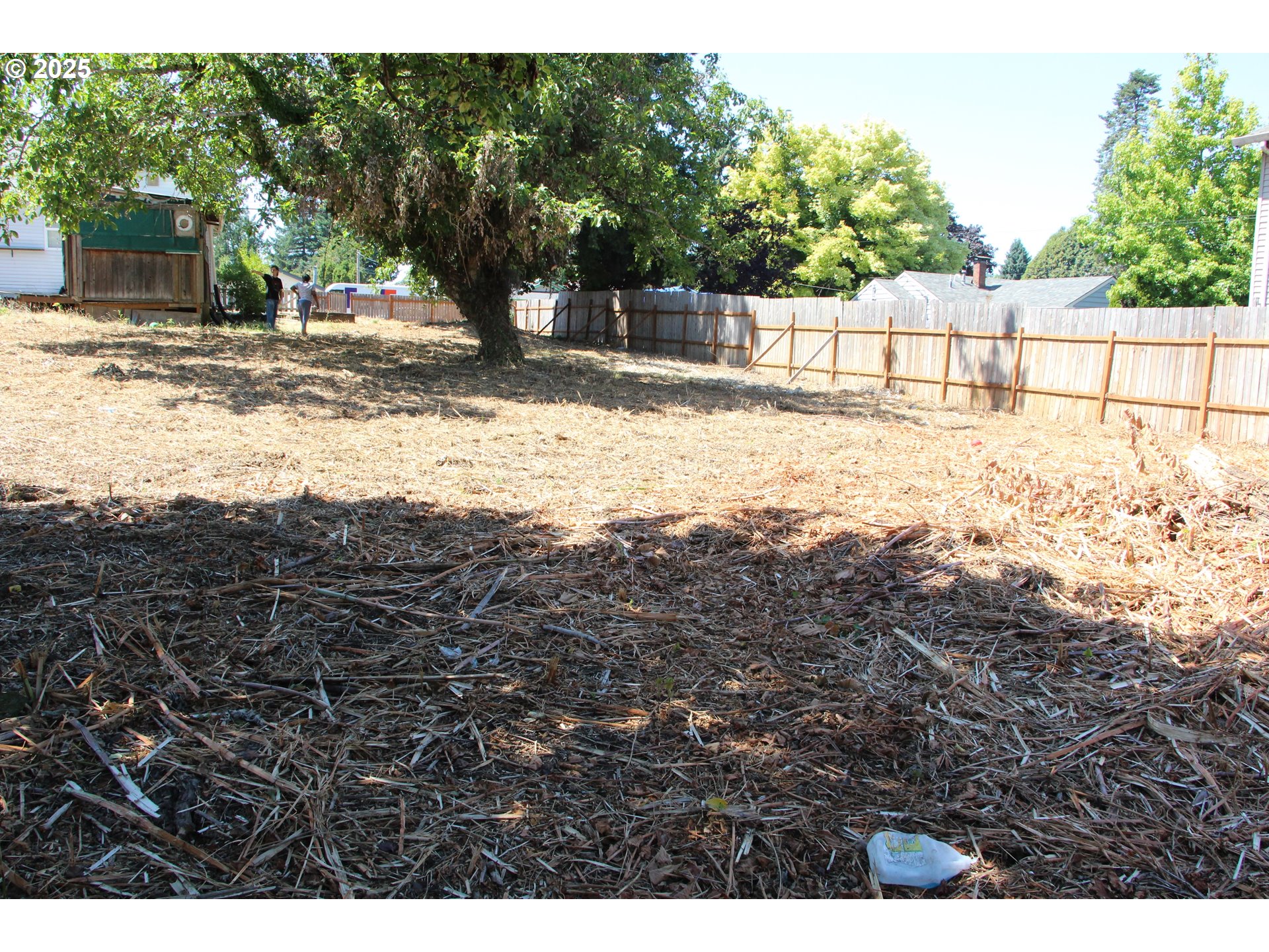Southeast 87th Avenue Portland, OR 97266 - Photo 17 of 17 a view of a yard with wooden fence
