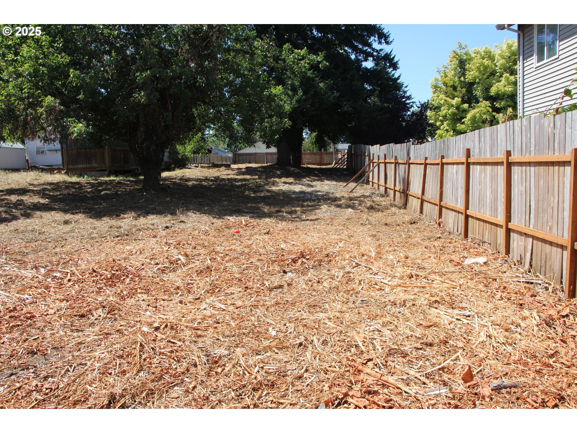 Southeast 87th Avenue Portland, OR 97266 - Photo 3 of 17 a view of yard with wooden fence