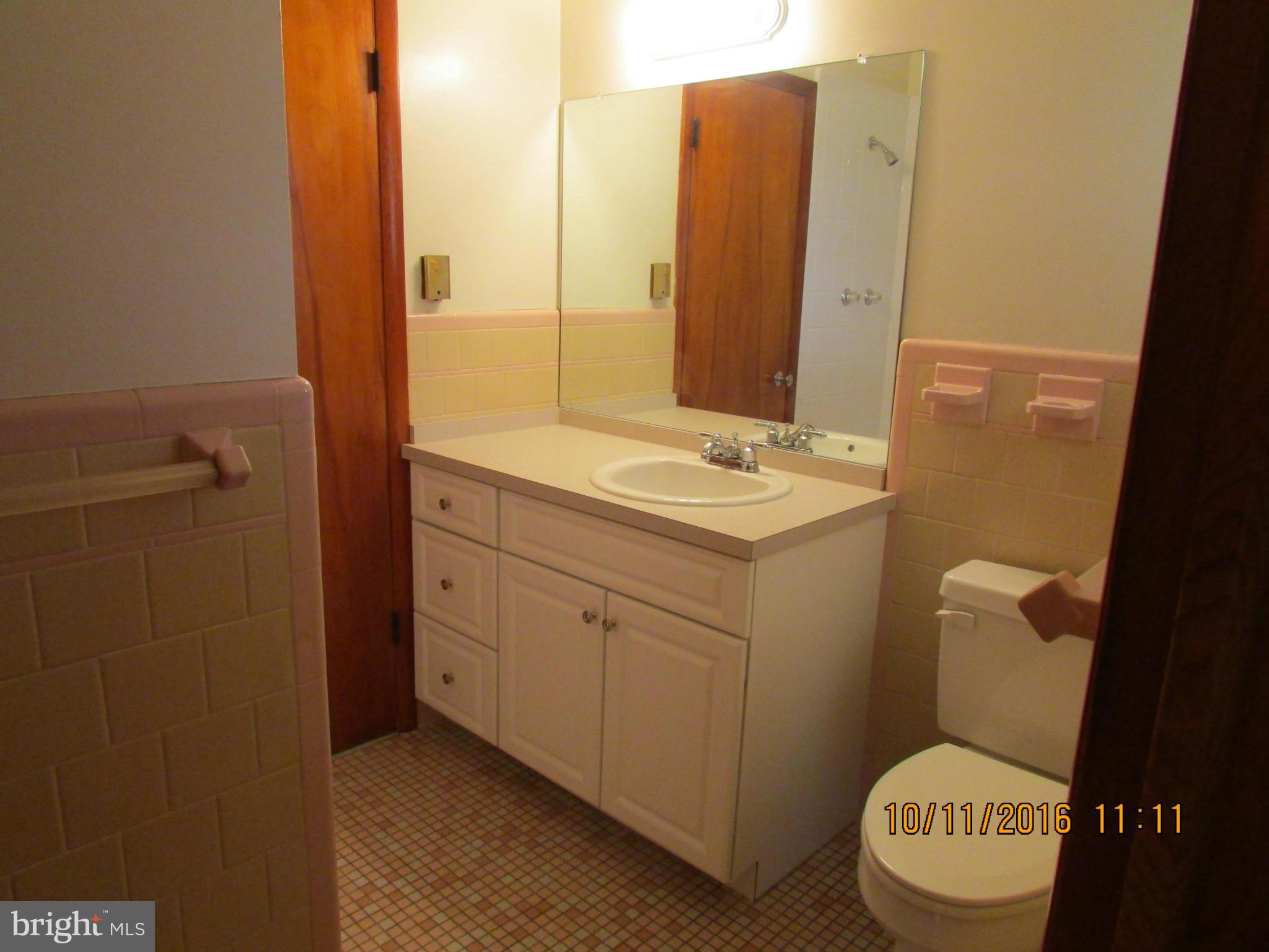 9250 Brown Church Road Mount Airy, MD 21771 - Photo 11 of 23 a bathroom with a granite countertop sink and a mirror