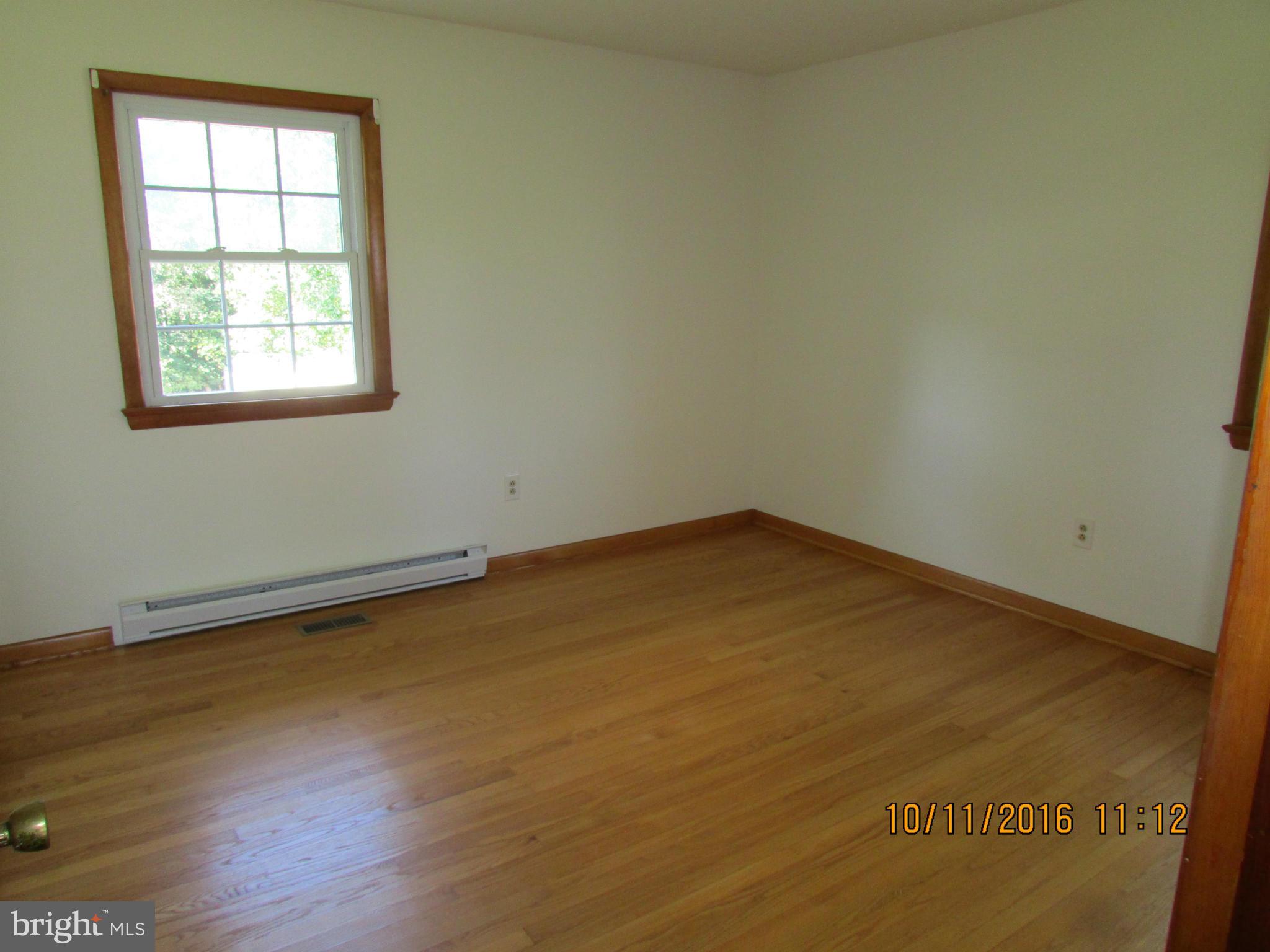 9250 Brown Church Road Mount Airy, MD 21771 - Photo 13 of 23 an empty room with wooden floor and windows