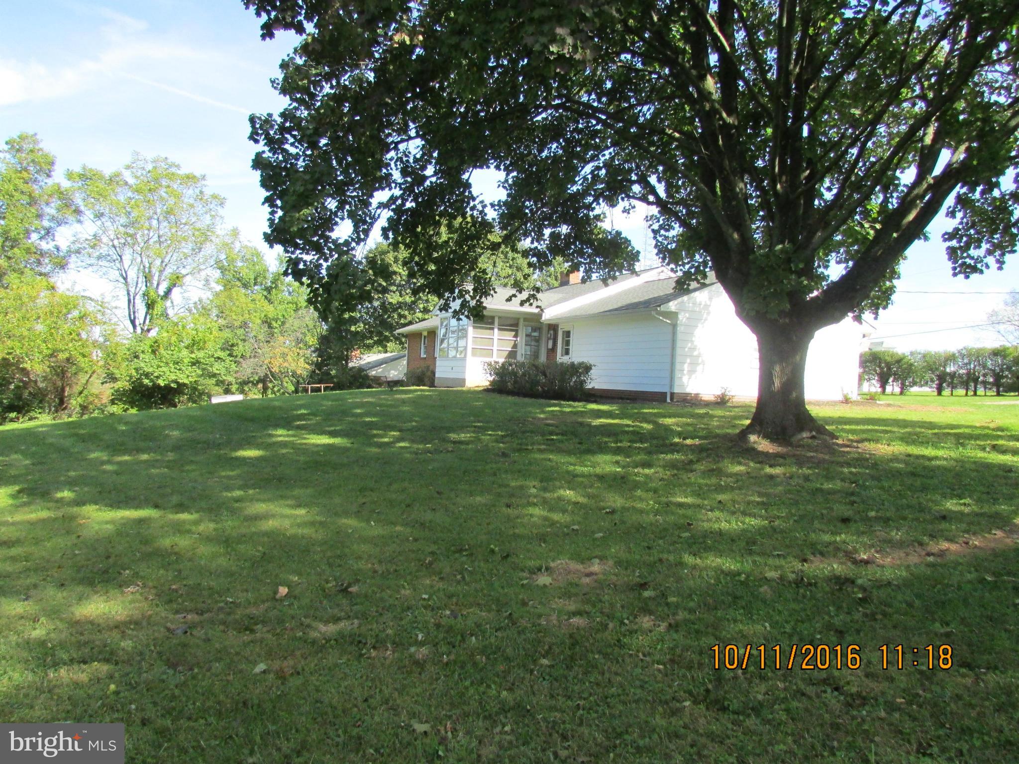 9250 Brown Church Road Mount Airy, MD 21771 - Photo 23 of 23 a backyard of a house with lots of green space and outdoor seating