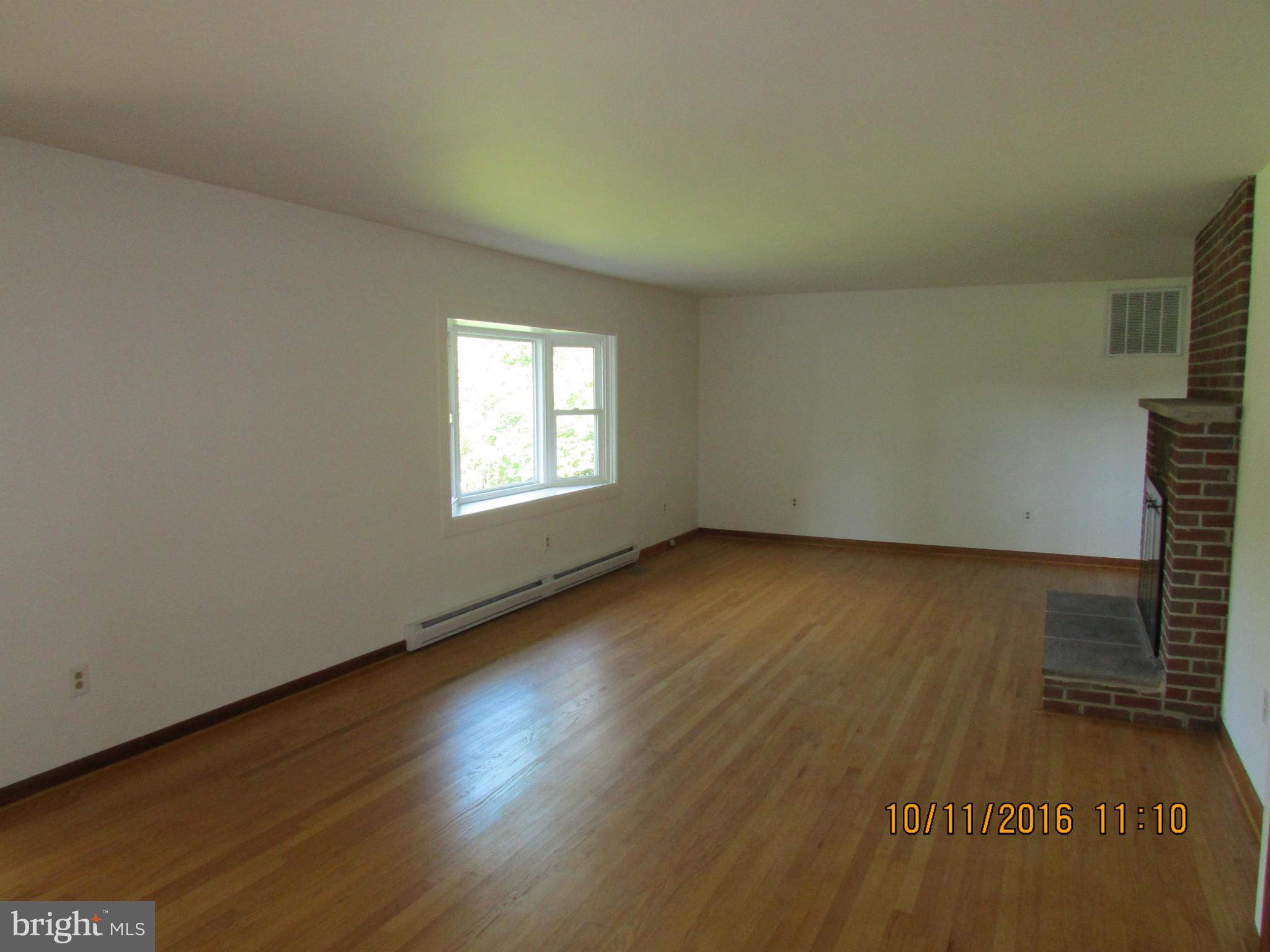 9250 Brown Church Road Mount Airy, MD 21771 - Photo 7 of 23 an empty room with wooden floor and windows