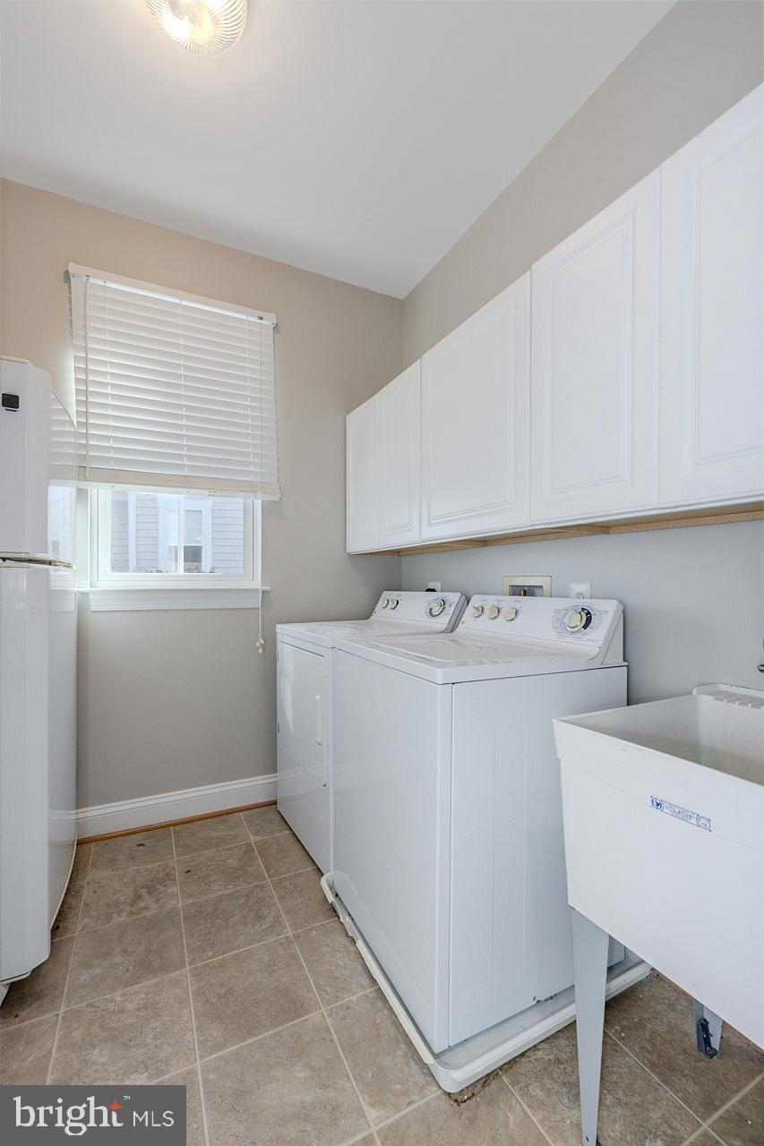 172 Ruffed Grouse Court White Post, VA 22663 - Photo 11 of 62 a utility room with cabinets washer and dryer