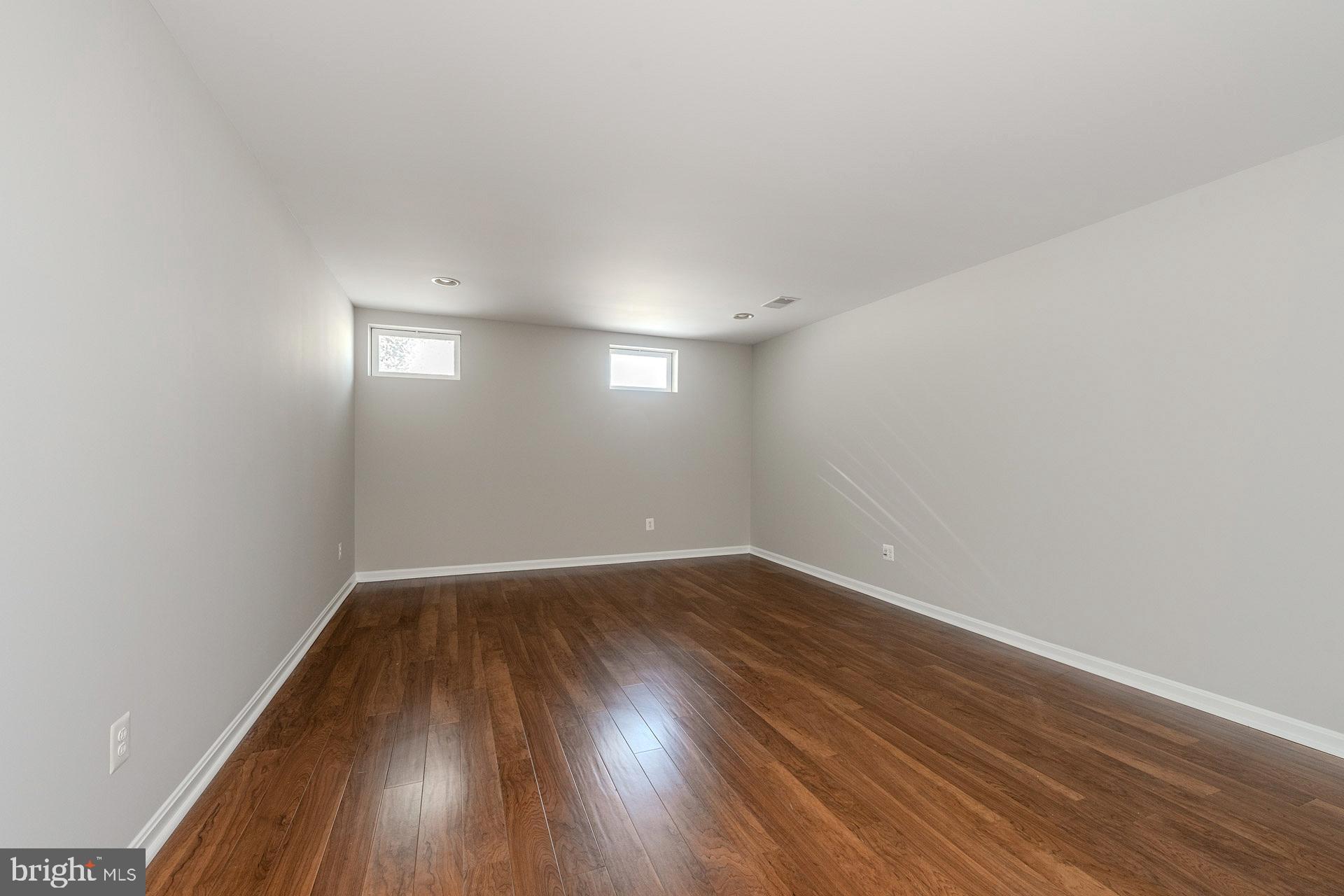 172 Ruffed Grouse Court White Post, VA 22663 - Photo 32 of 62 a view of an empty room with wooden floor