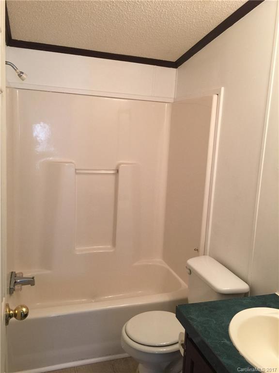 136 Morrison Road Mocksville, NC 27028 - Photo 8 of 14 a bathroom with a toilet a sink and shower
