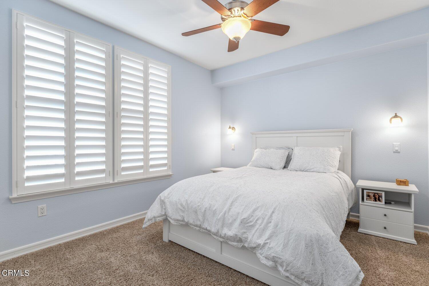 1481 Windshore Way Oxnard, CA 93035 - Photo 20 of 31 a bedroom with a large bed and a window