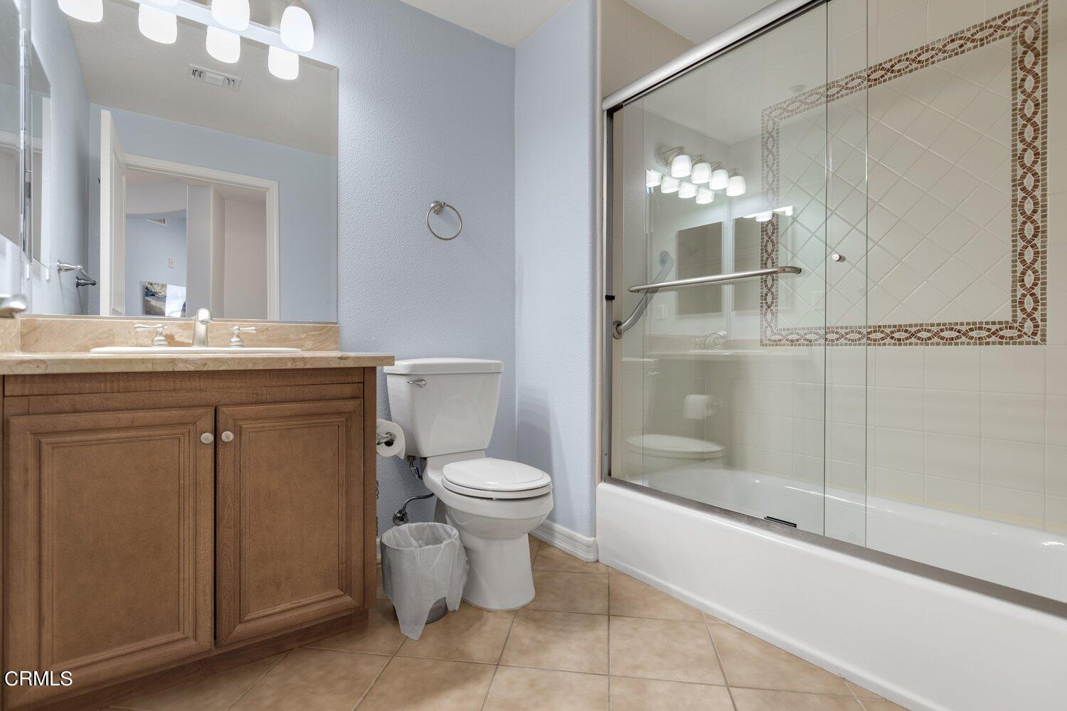1481 Windshore Way Oxnard, CA 93035 - Photo 21 of 31 a bathroom with a granite countertop sink toilet and shower